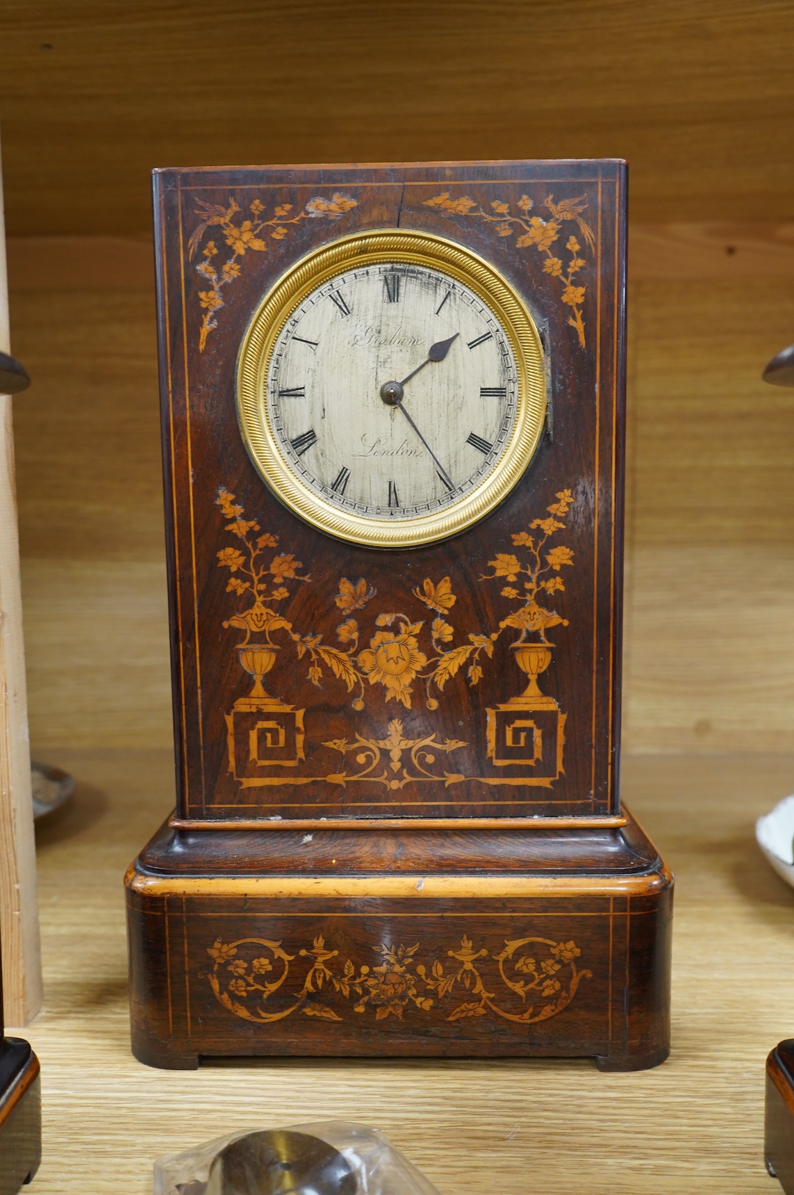 A late 19th century rosewood marquetry clock garniture by Graham, London, 35cm
